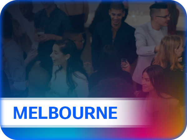 Group of people gathered at an indoor event with a bold text overlay reading 'MELBOURNE' in blue on a white banner with a gradient border.