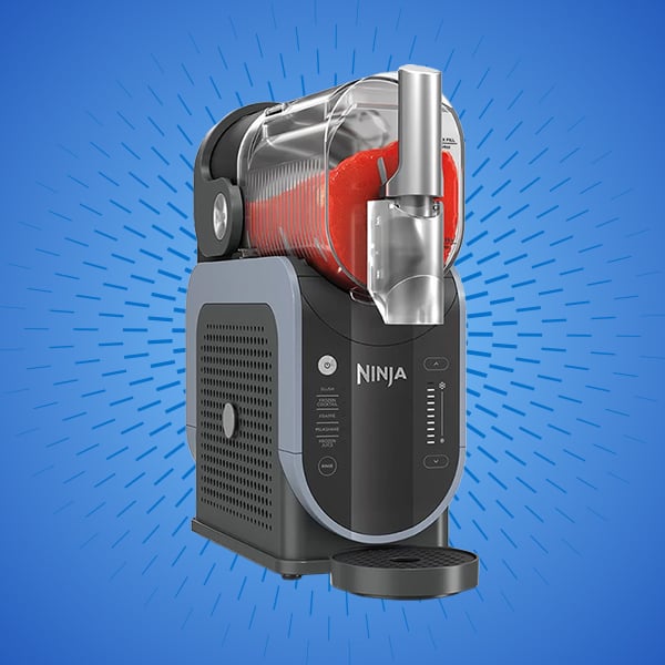 Ninja frozen drink machine with red slush inside.