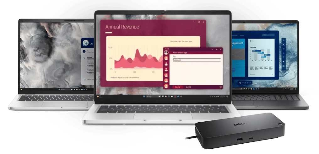 Three laptops displaying software dashboards and charts, with a Dell docking station in front.