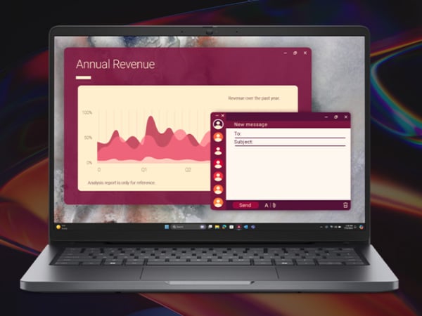 Laptop screen showing an annual revenue chart and email compose window in a red interface