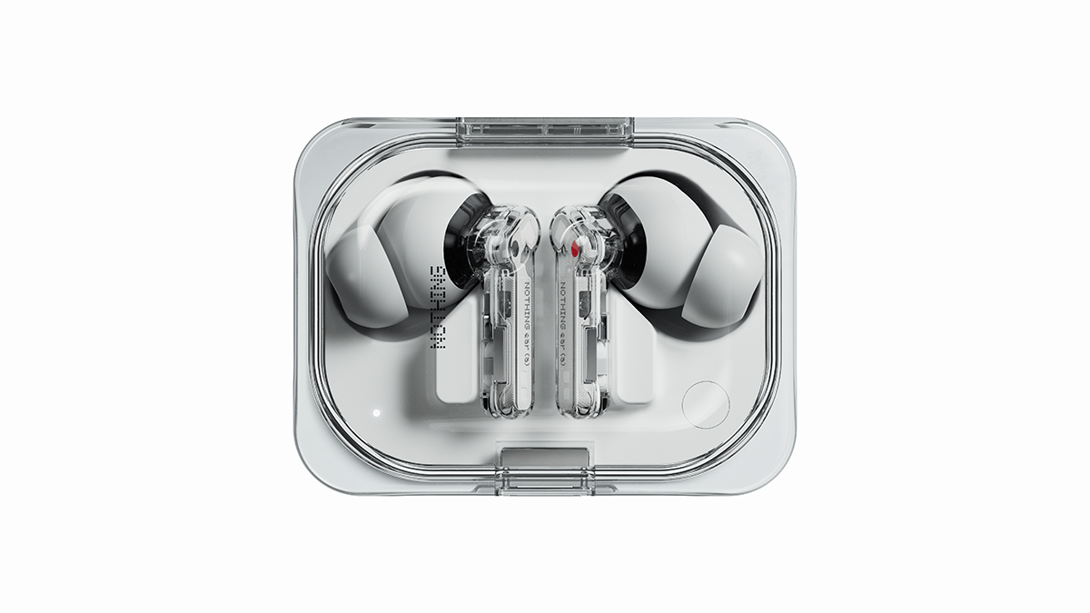 Transparent case holding modern white earbuds with sleek black and silver accents. The case and earbuds have a minimalist, high-tech design.