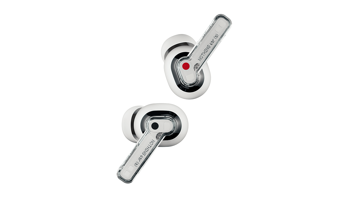 Two sleek, transparent earbuds with a white base and red accents. The design is modern and minimalist, with visible internal components.