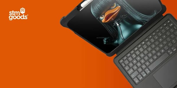 Rugged tablet case with an attached keyboard, displaying a stylized cartoon duck character on the screen.