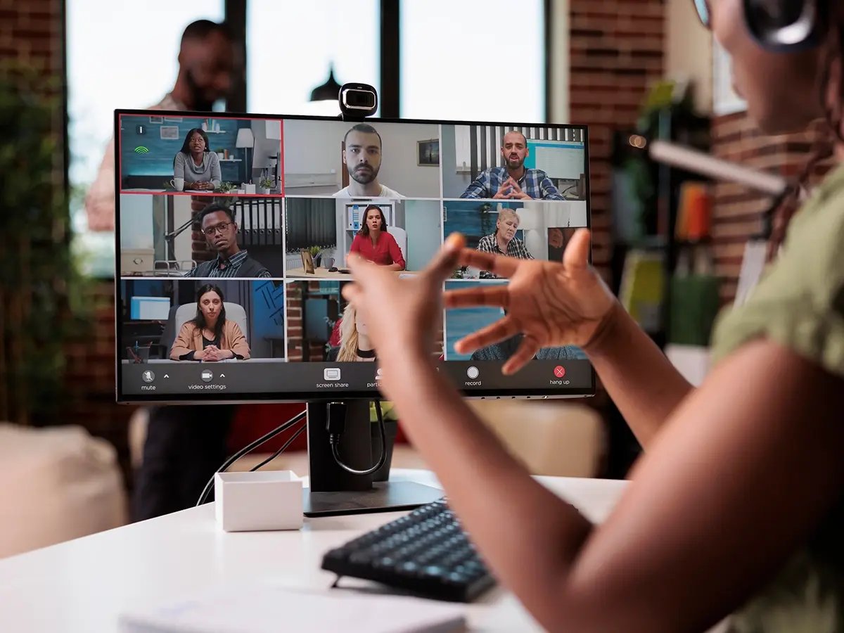 Group video call displayed on a desktop monitor.