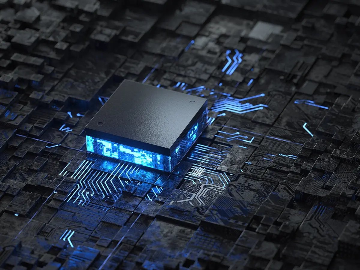 Glowing processor chip on a dark circuit board.