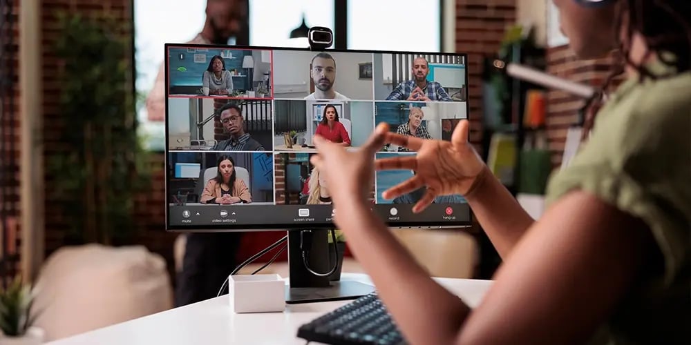 Group video call displayed on a desktop monitor.