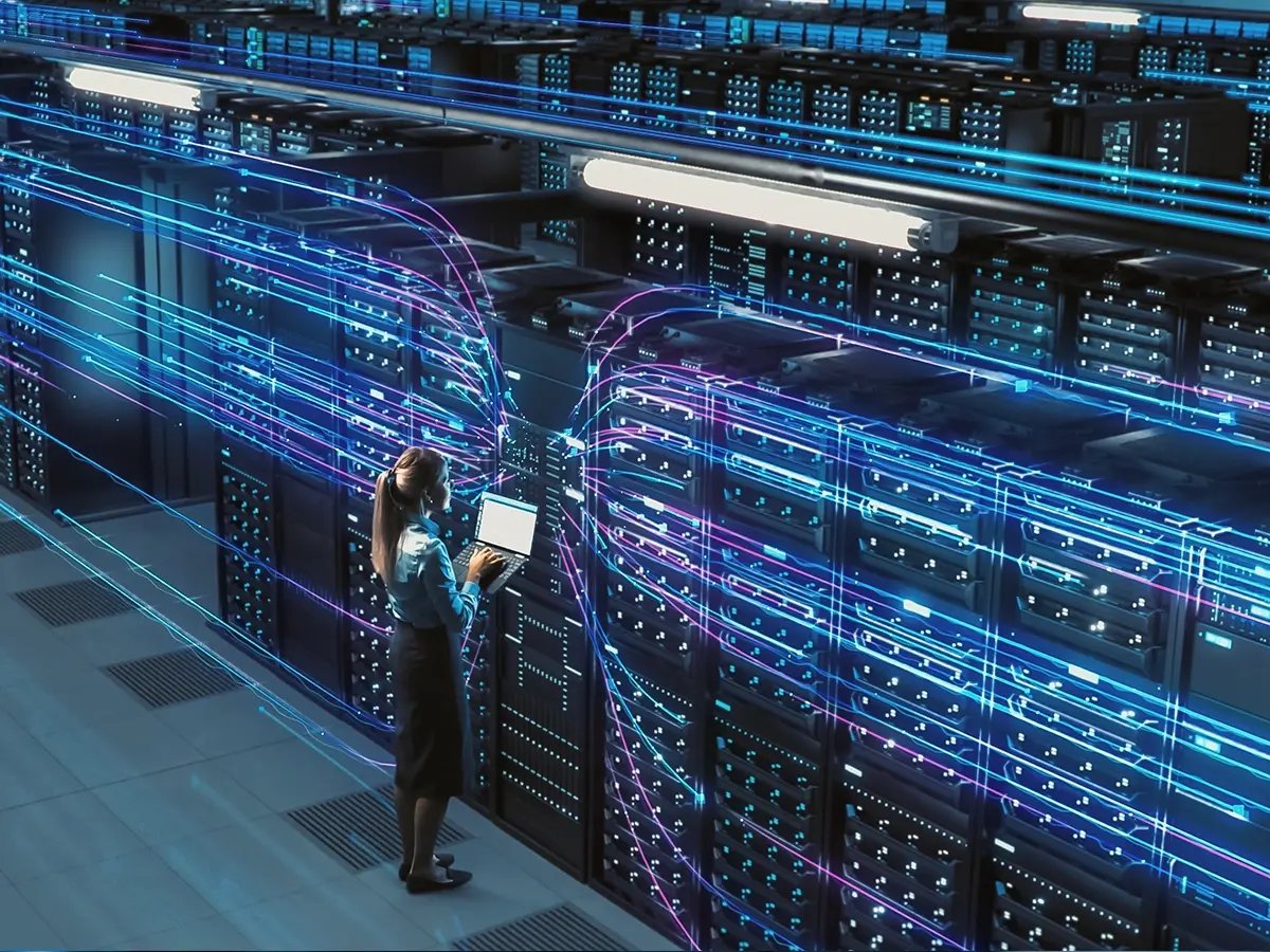 Abstract visualization of data streams flowing from a server rack.