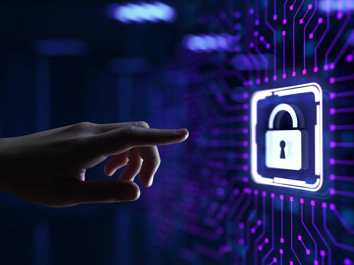 Hand reaching toward a glowing digital padlock icon on a circuit-style interface, symbolizing cybersecurity or data protection.