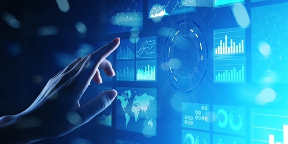 Hand reaching toward a digital screen showing charts, graphs, and a world map.