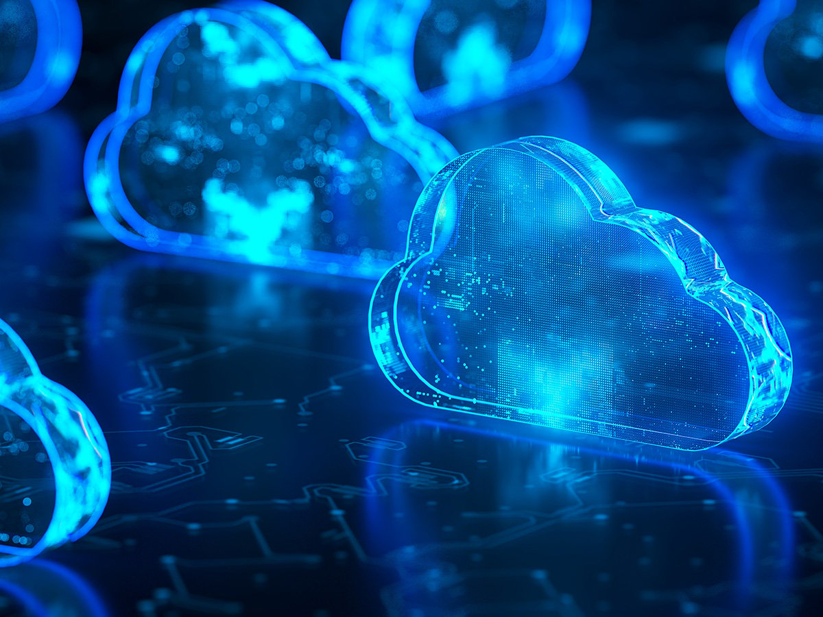Glowing blue cloud icons on a dark digital surface, symbolising distributed cloud computing.