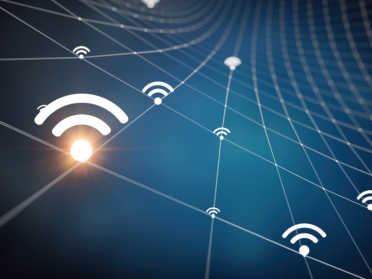 Abstract network diagram with connected Wi‑Fi symbols and grid lines.