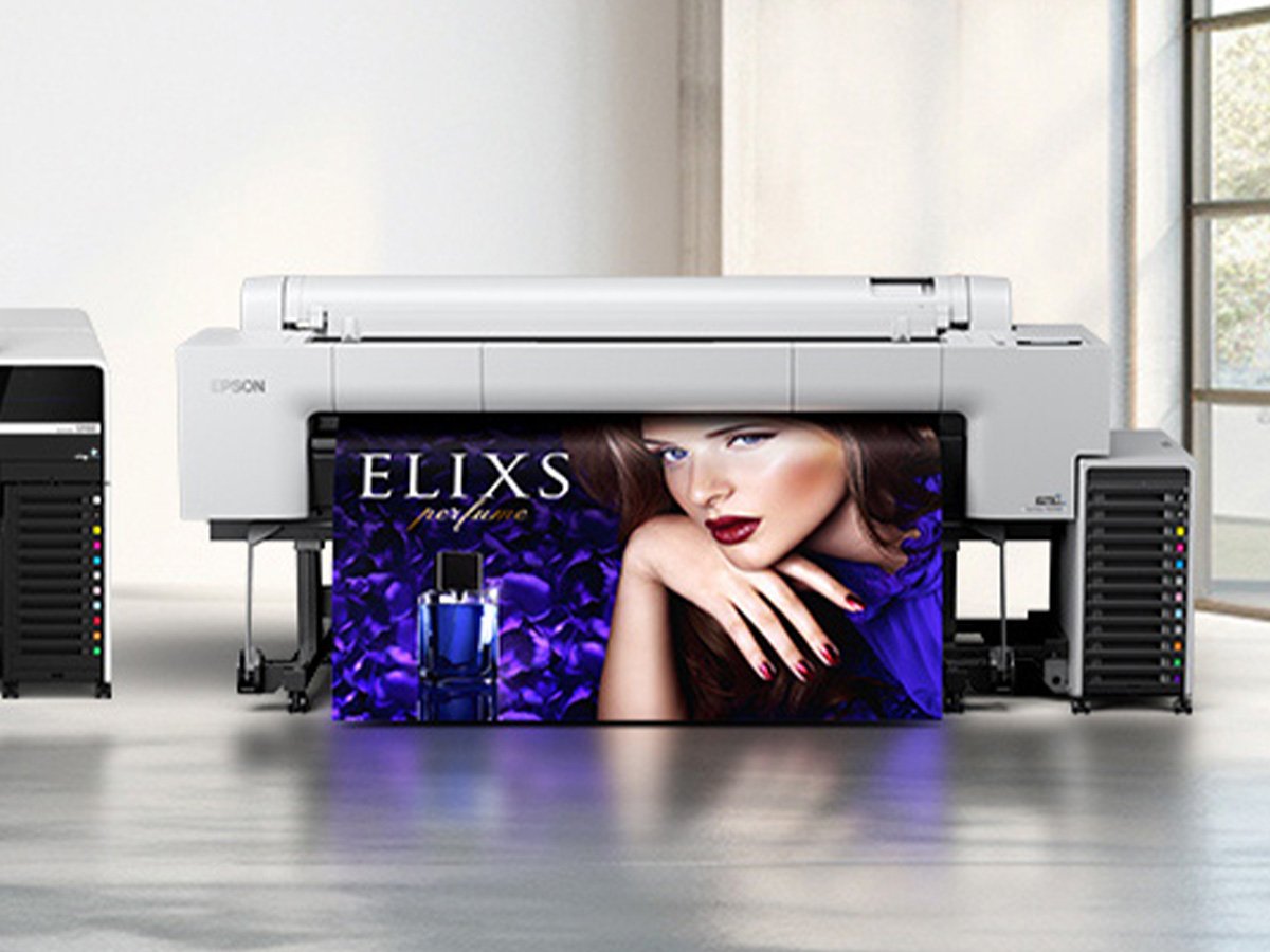 Large Epson printer printing a vibrant perfume advertisement banner.