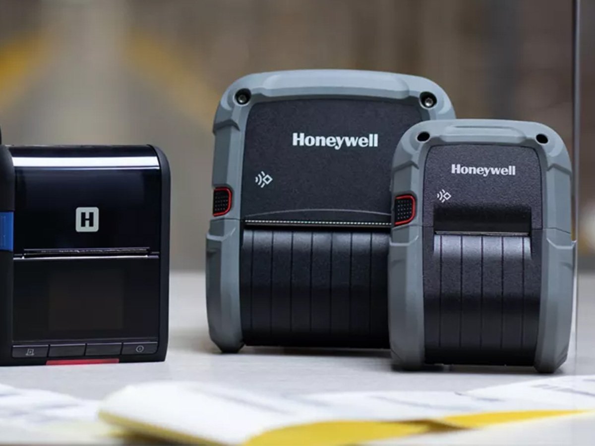 Honeywell portable label printers in different sizes on a desk.