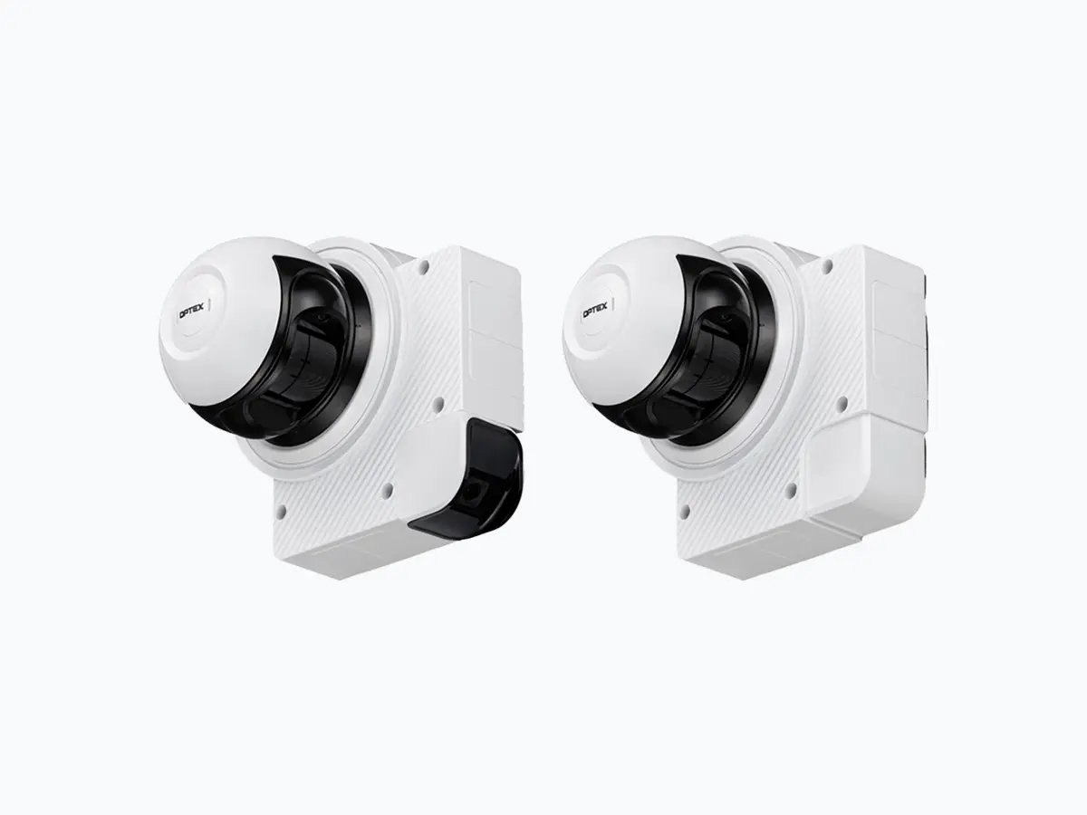 Two white wall-mounted security cameras with black lenses, shown against a plain light background.