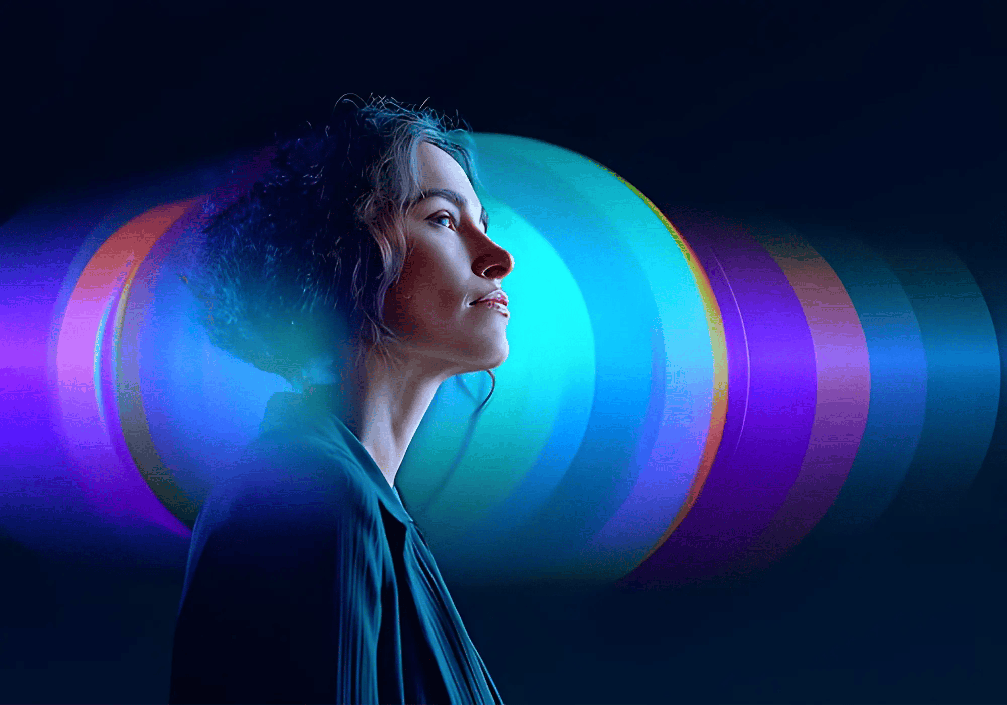 A person gazes upward, silhouetted against a colorful, abstract background of swirling blue, purple, and pink lights, conveying a sense of wonder.