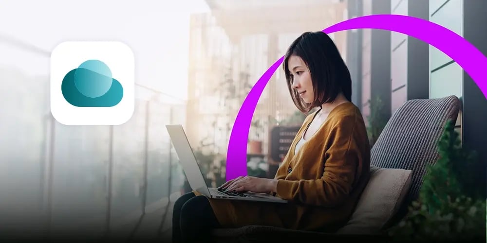 A woman sits outdoors on a cushioned chair, focused on her laptop. A purple arc frames her, with a cloud icon to the left. The scene is calm and modern.