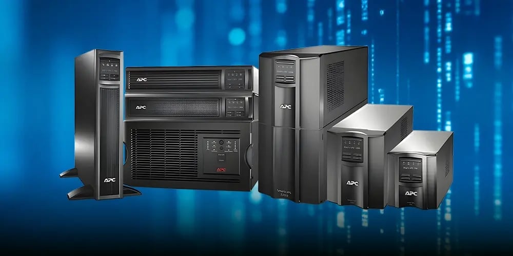 A group of APC uninterruptible power supplies of different sizes displayed against a blue, digital-themed background, conveying technology and reliability.