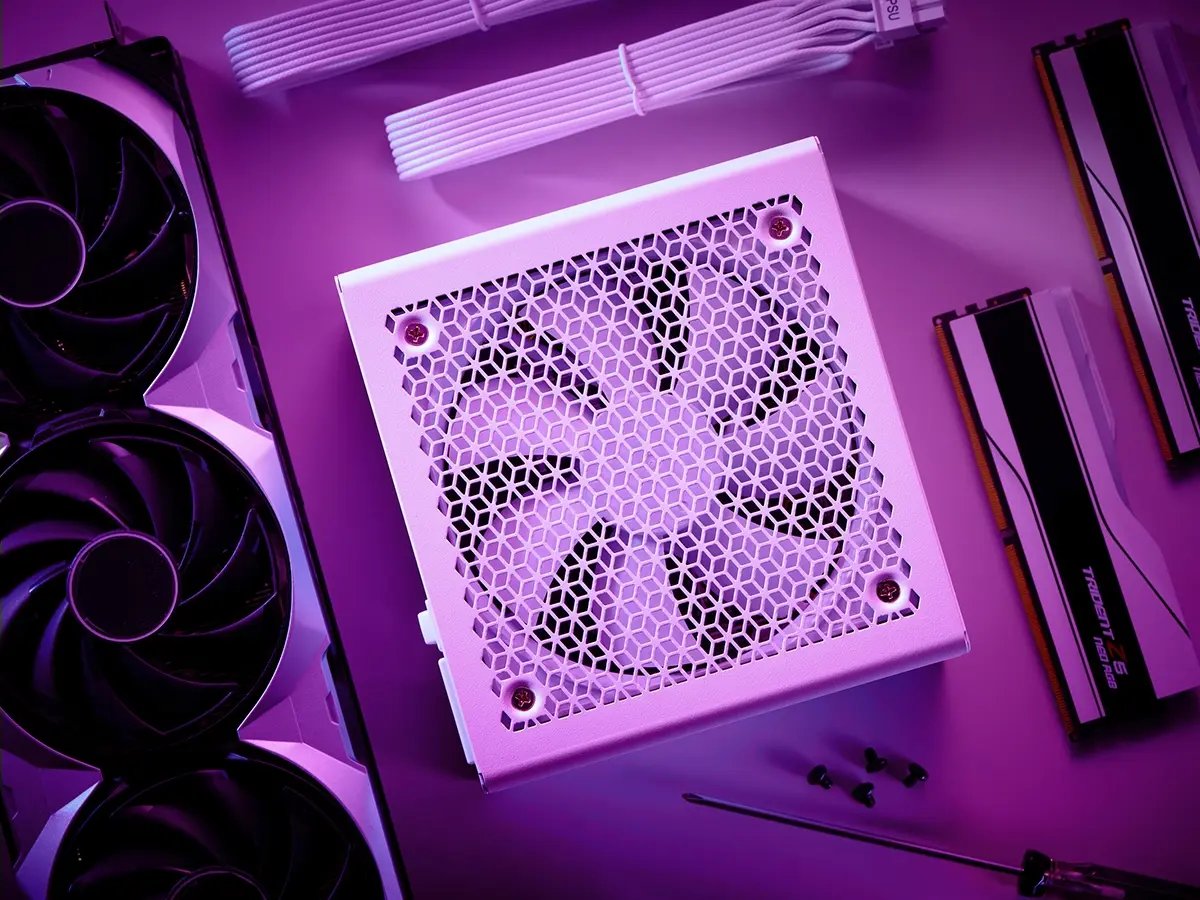 Purple-lit close-up of computer components: a white power supply unit with fan, GPU, RAM sticks, and cables, evoking a sleek, techy vibe.