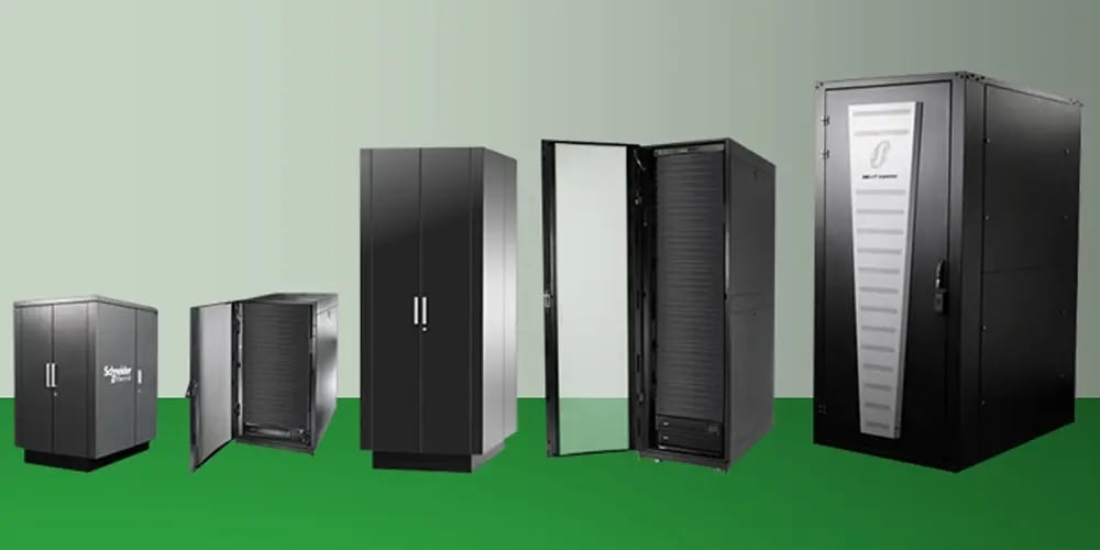 Row of black micro server cabinets of varying sizes, including closed and open units, displayed on a green surface against a light gray background, representing compact server solutions.