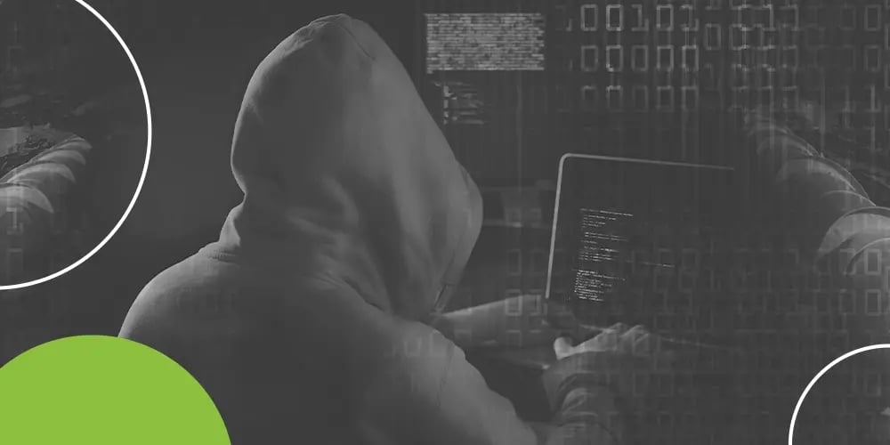 Hooded figure in a dark environment with digital code in the background.