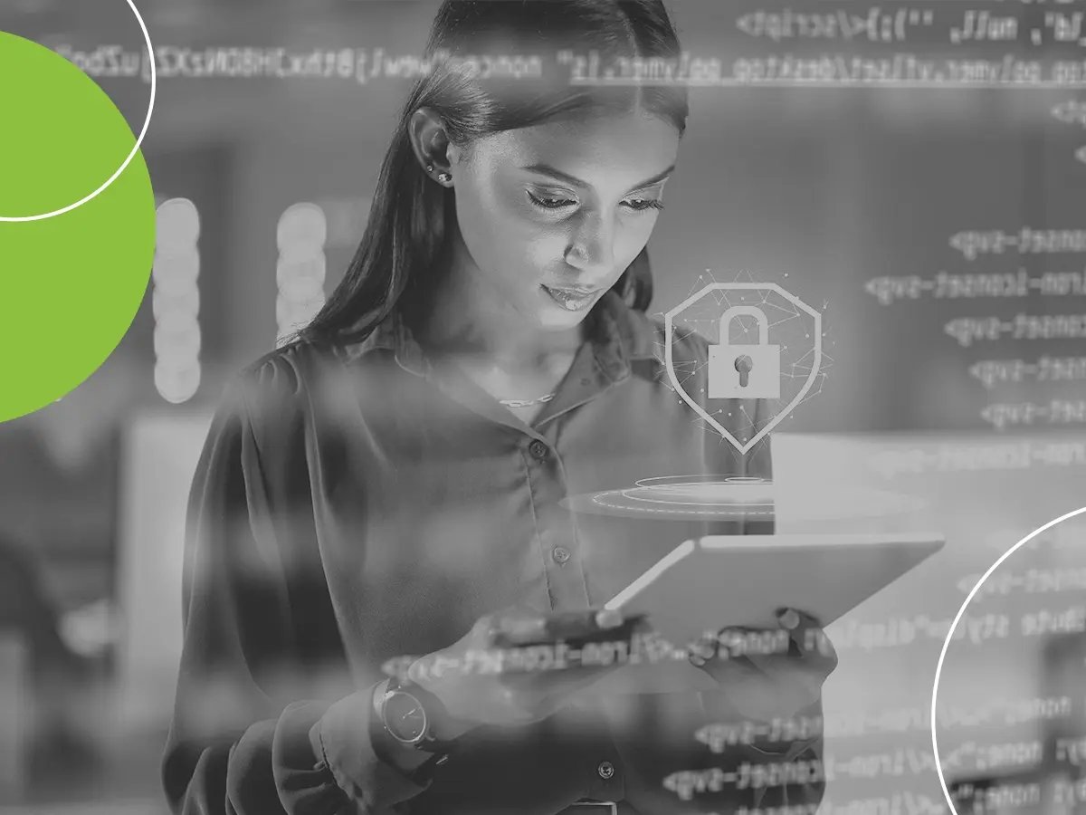 Person using a tablet with digital security icons and code overlays.