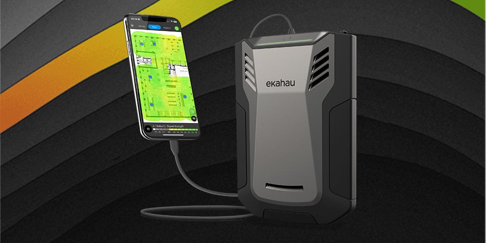 Ekahau Sidekick device connected to a smartphone displaying a Wi‑Fi heatmap and survey results.