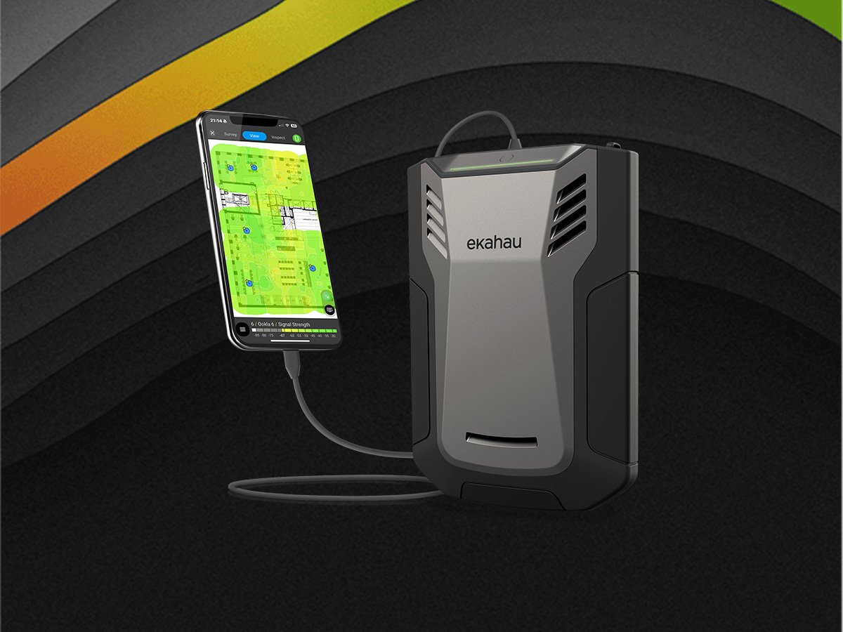 Ekahau Sidekick device connected to a smartphone displaying a Wi‑Fi heatmap and survey results.