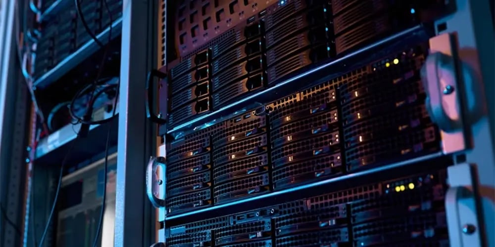 Close-up of enterprise server racks in a data center with indicator lights.