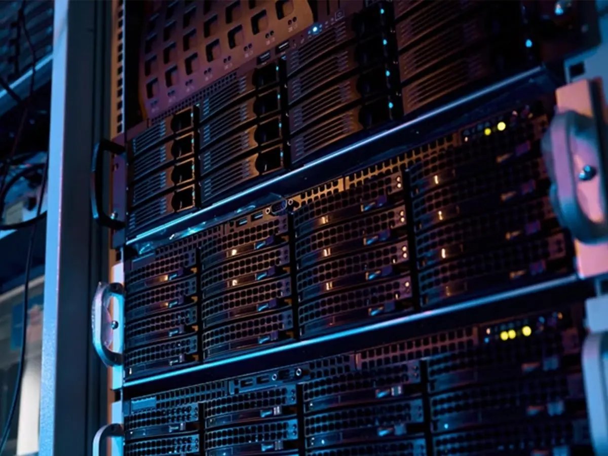 Close-up of enterprise server racks in a data center with indicator lights.