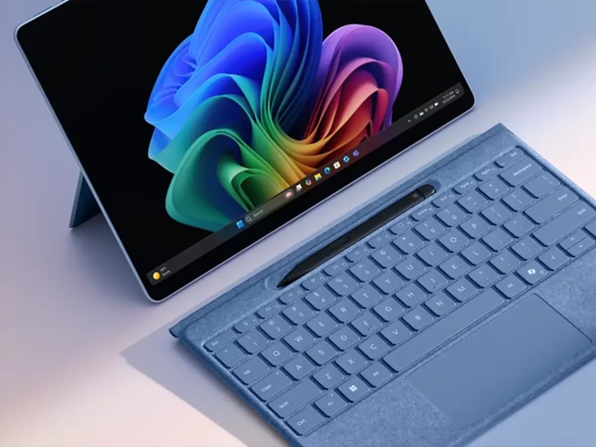 A Surface tablet with a detachable keyboard and a colorful Windows display.