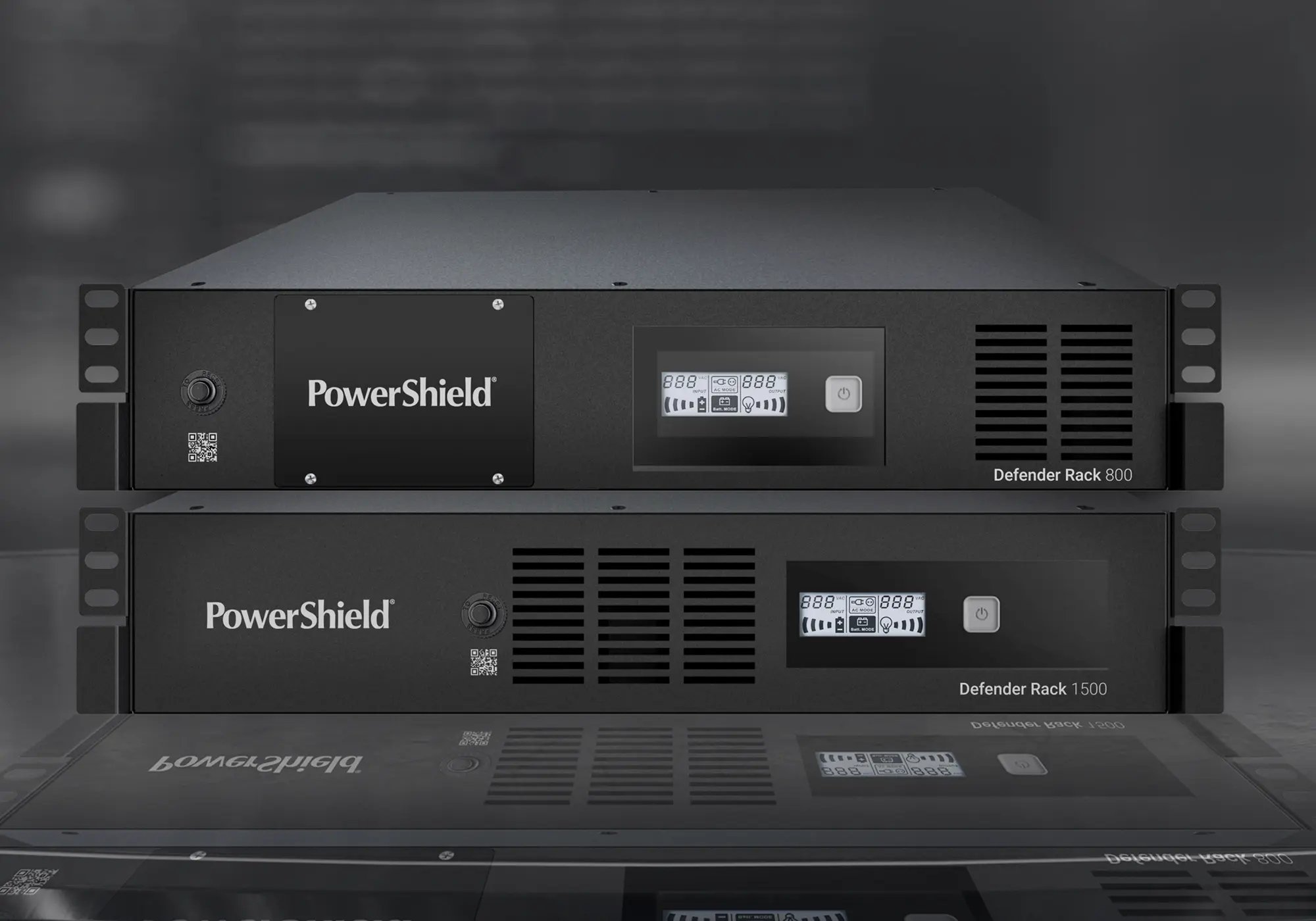 Two PowerShield rack-mounted units displayed on a reflective surface in a modern data‑center environment.