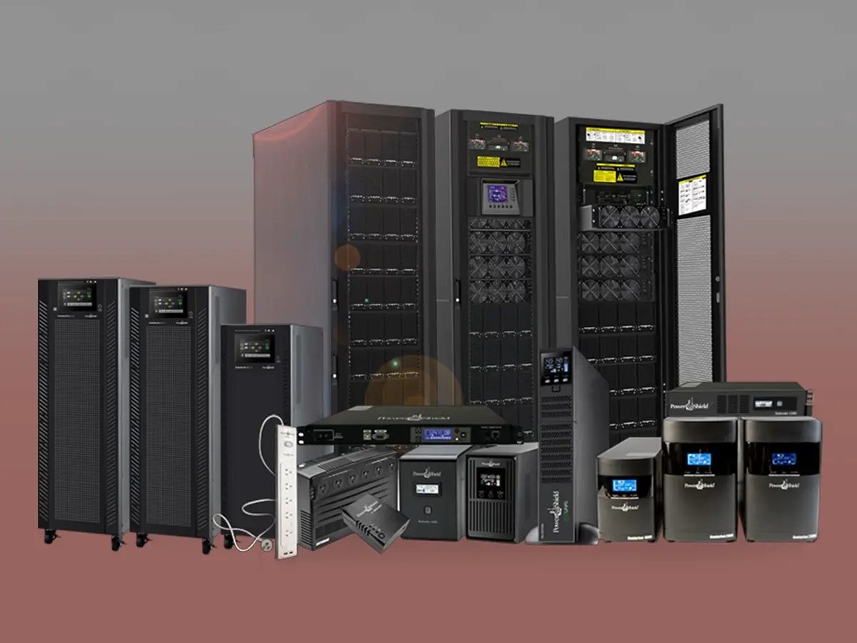 A wide range of PowerShield UPS systems and power distribution units arranged in front of large industrial cabinets