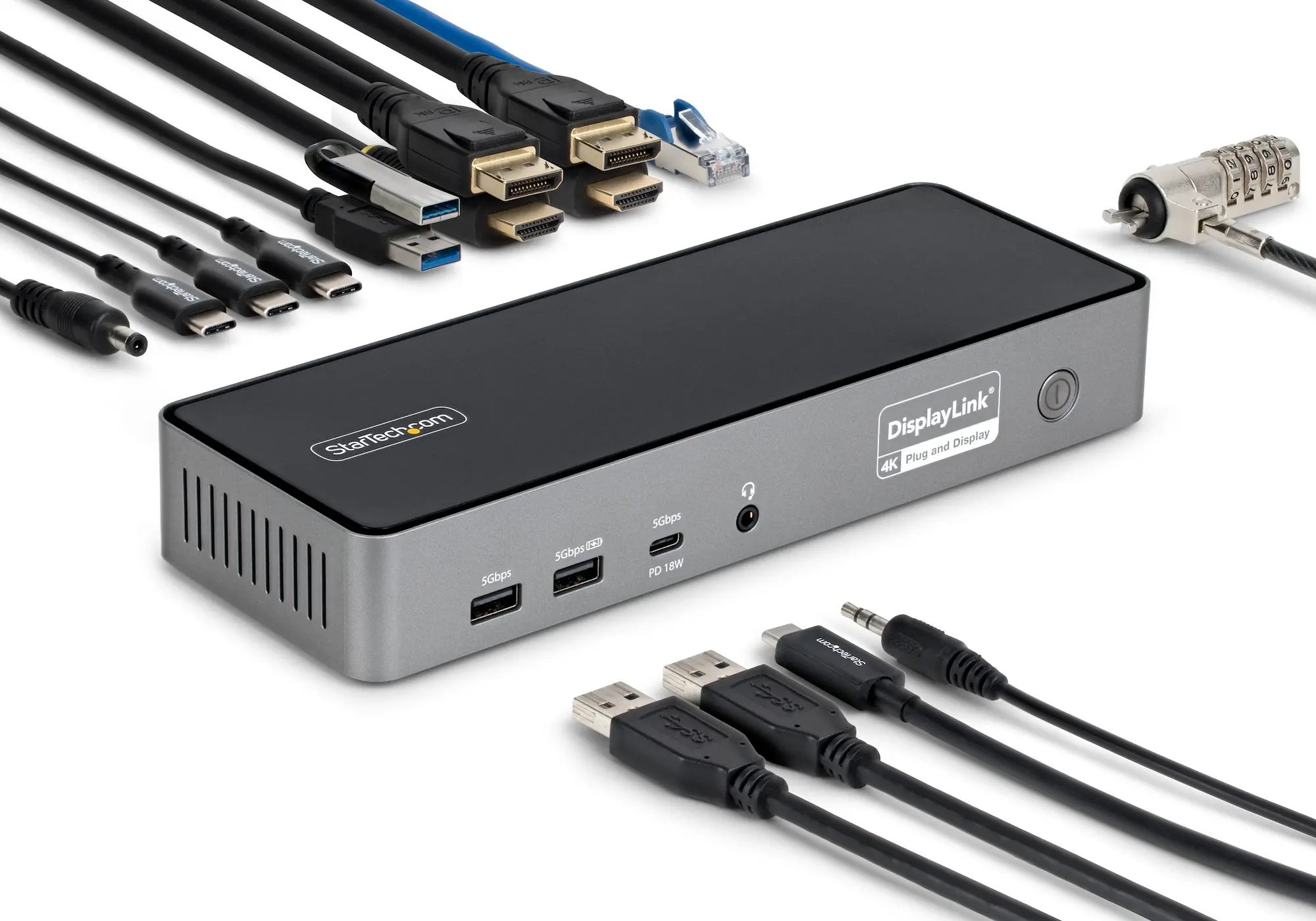 A StarTech DisplayLink docking station surrounded by various cables and connectors.
