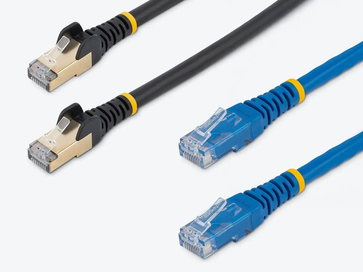 Two black shielded Ethernet cables and two blue Ethernet cables laid out side by side.