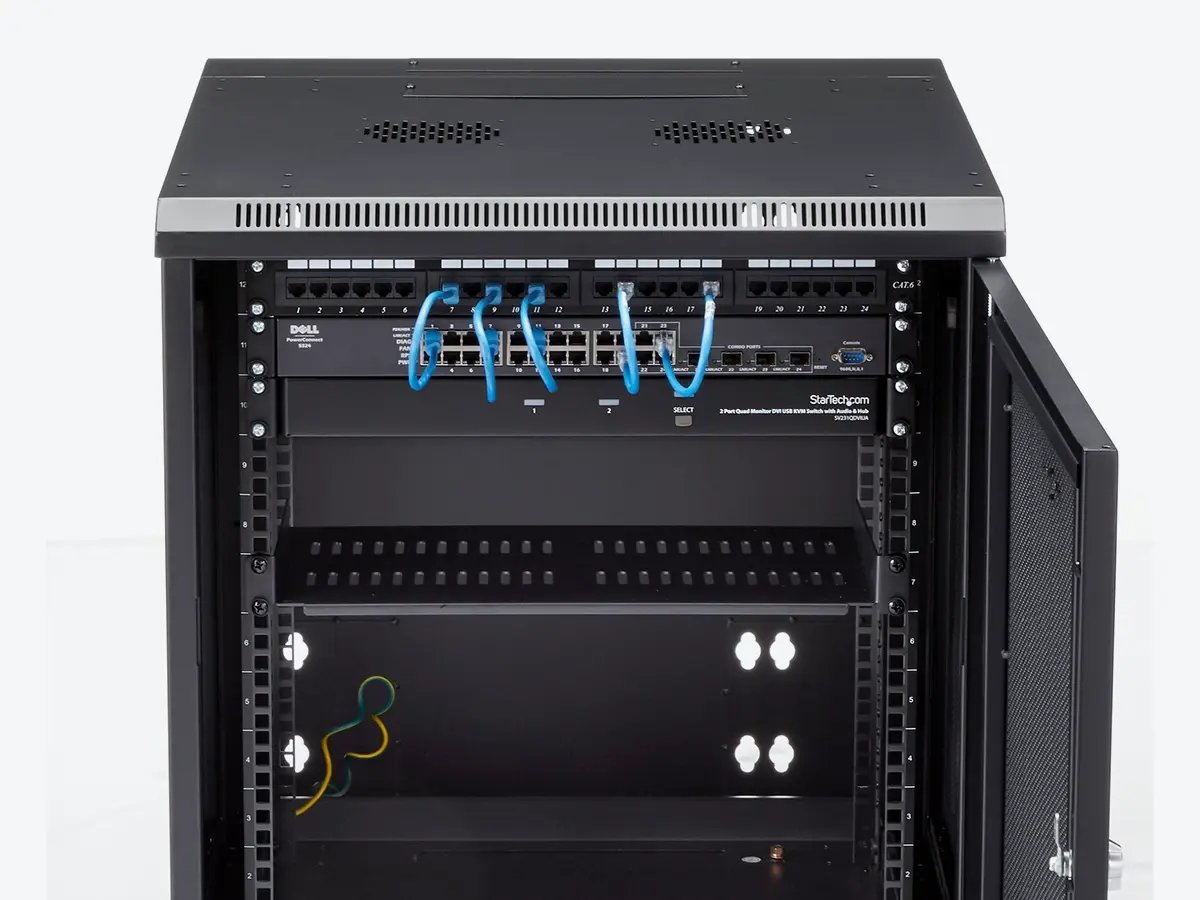 A StarTech wall‑mount rack cabinet shown empty beside a second cabinet containing mounted network equipment and cables.