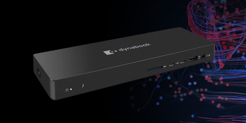 Black Dynabook docking station with multiple ports on a dark background.