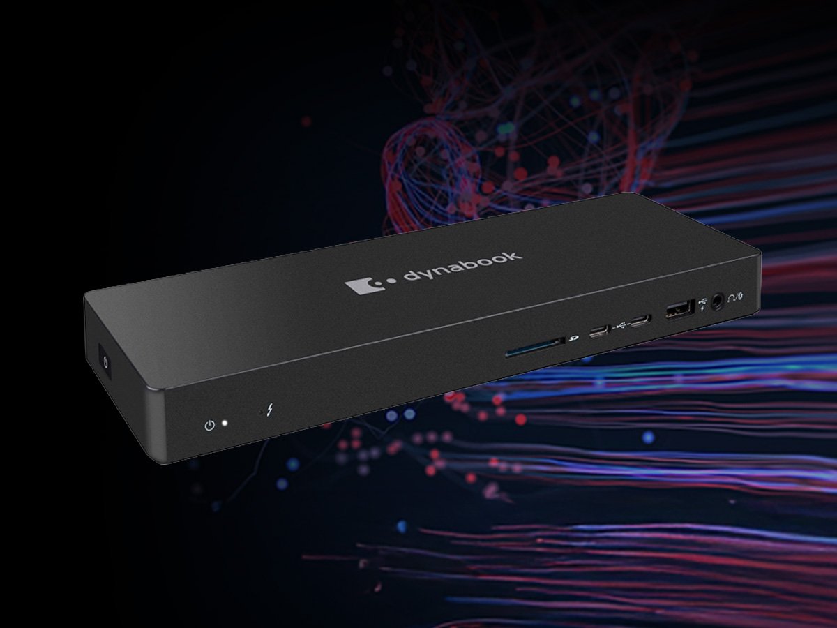 Black Dynabook docking station with multiple ports on a dark background.