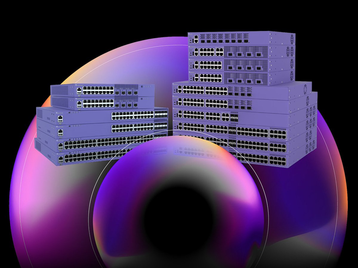 Stacked enterprise network switches with multiple Ethernet ports, shown against a dark gradient background