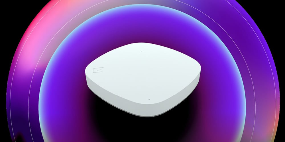 White wireless access point shown in a studio setting with layered gradient arcs representing network coverage.