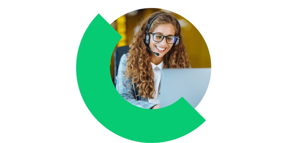 Customer support agent wearing a headset working on a laptop, framed by a circular graphic.