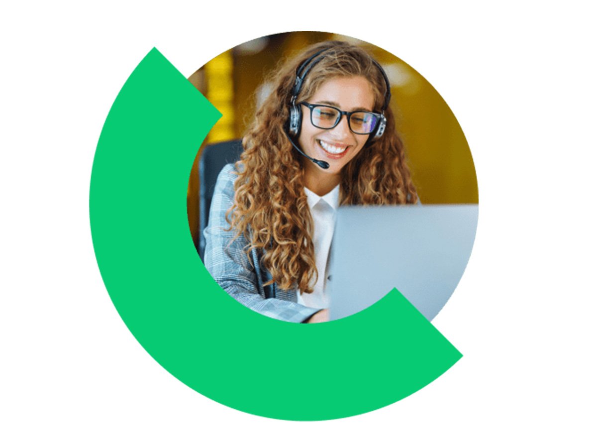 Customer support agent wearing a headset working on a laptop, framed by a circular graphic.