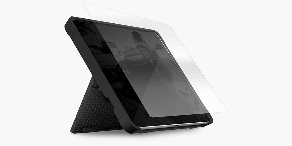 Tablet with a rugged case and screen protector on a stand.