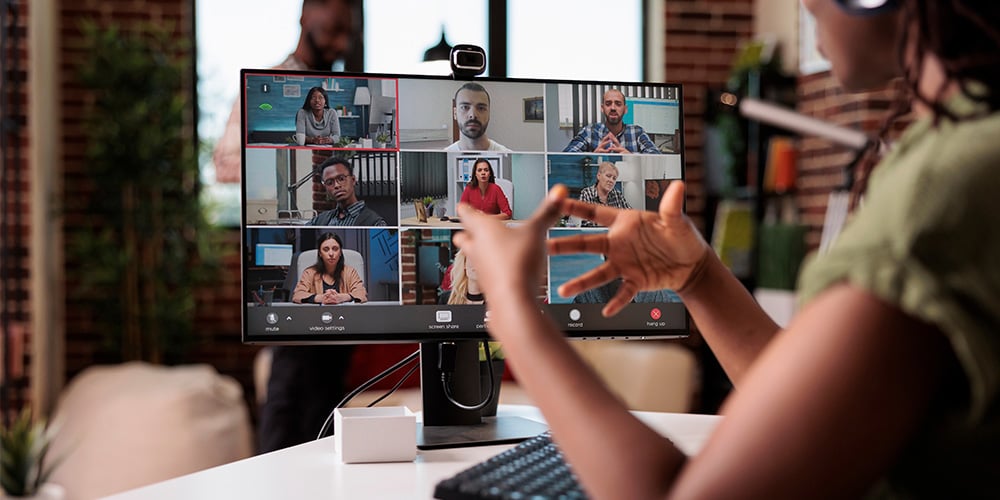 Person sitting at desk on a video conference call
