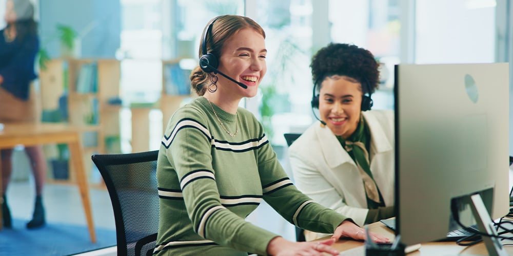 Person wearing a headset working at a desktop