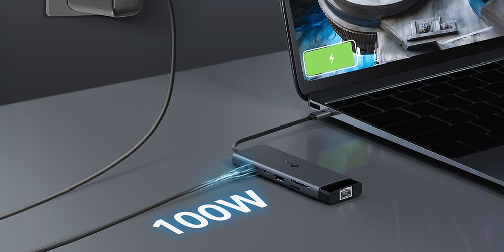 USB‑C docking adapter connected to a laptop, displaying high‑speed wired network connectivity.