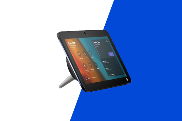 Small touchscreen control panel on a stand showing a meeting room interface.