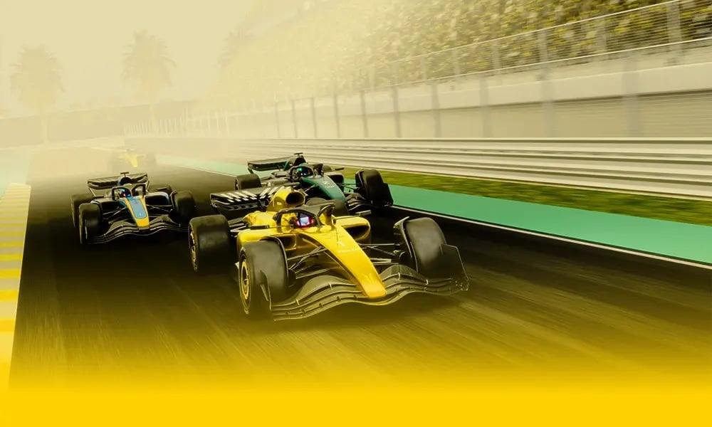 Formula race cars speeding on a track.