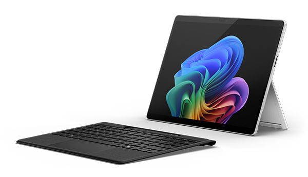 Microsoft Surface Pro tablet with detachable keyboard, displaying a colorful Windows wallpaper on a white background.