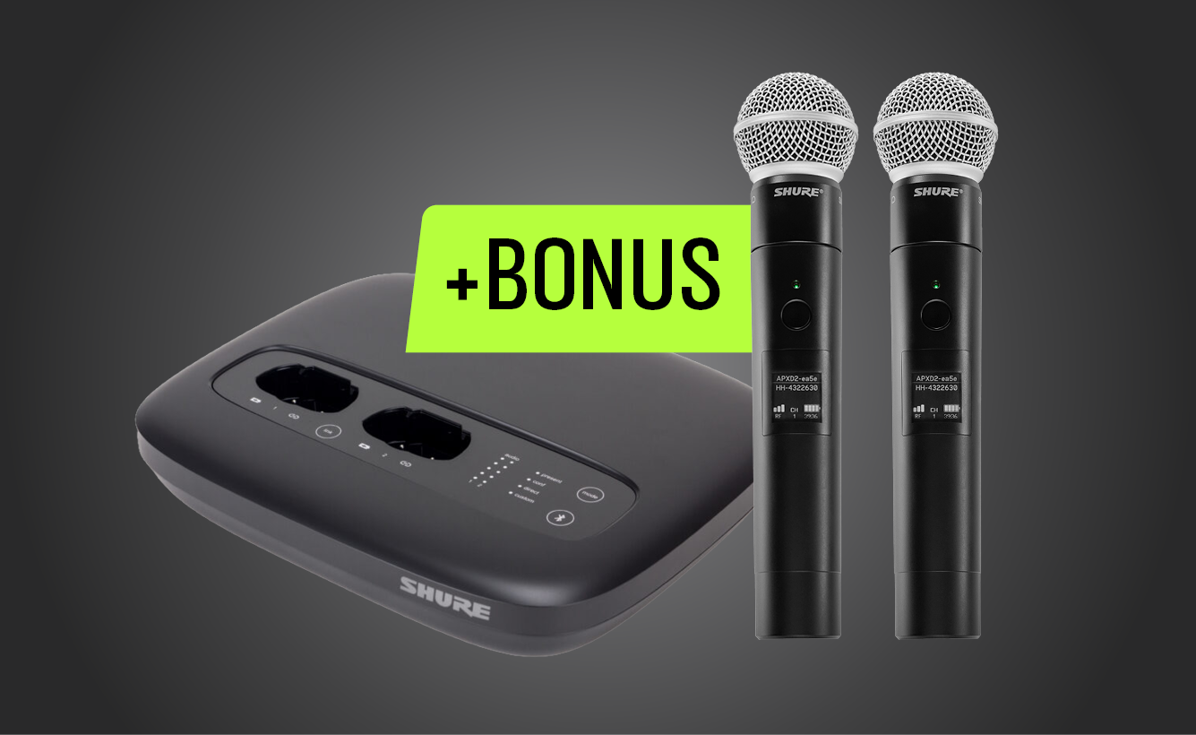 Shure wireless microphone system with two handheld microphones and a base unit, featuring a bright green ‘+Bonus’ label.