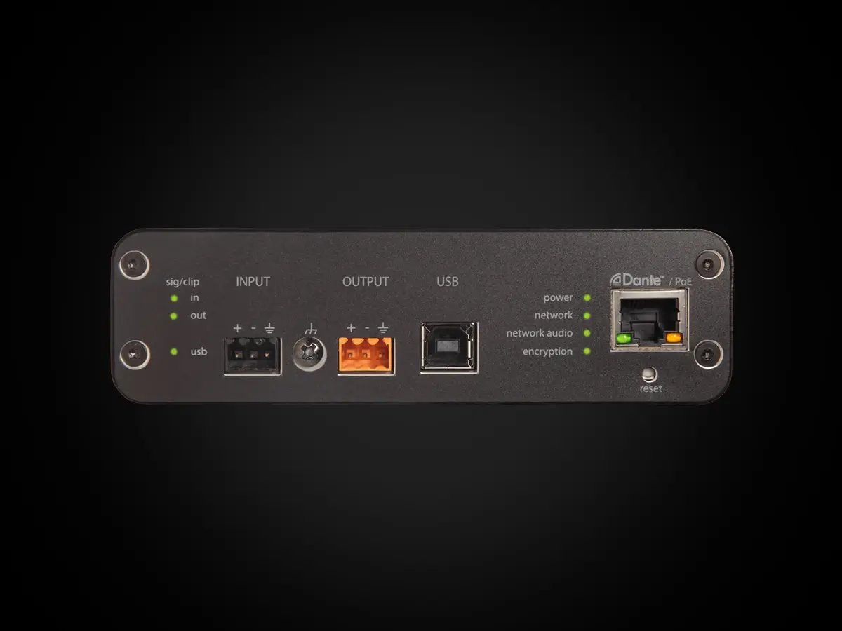 Rear view of a Shure audio interface displaying input, output, USB, and network ports.